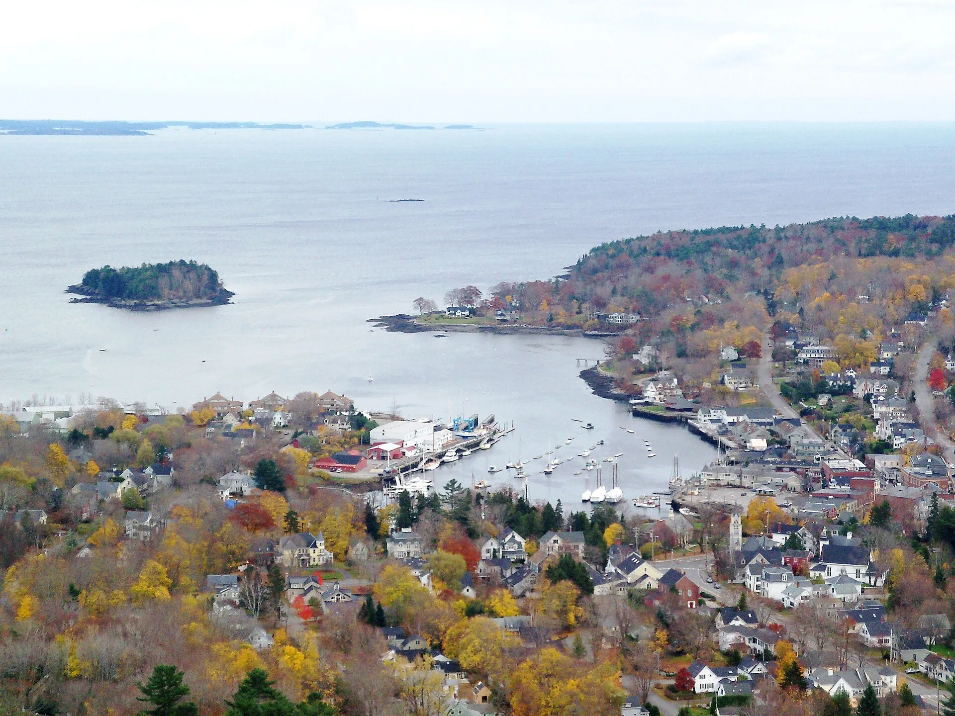 Camden Harbour from the Mount Battie summit, with Curtis Island offshore and schooners at the town landing. This is the view the auto road delivers, though the road gate comes down at 4pm.