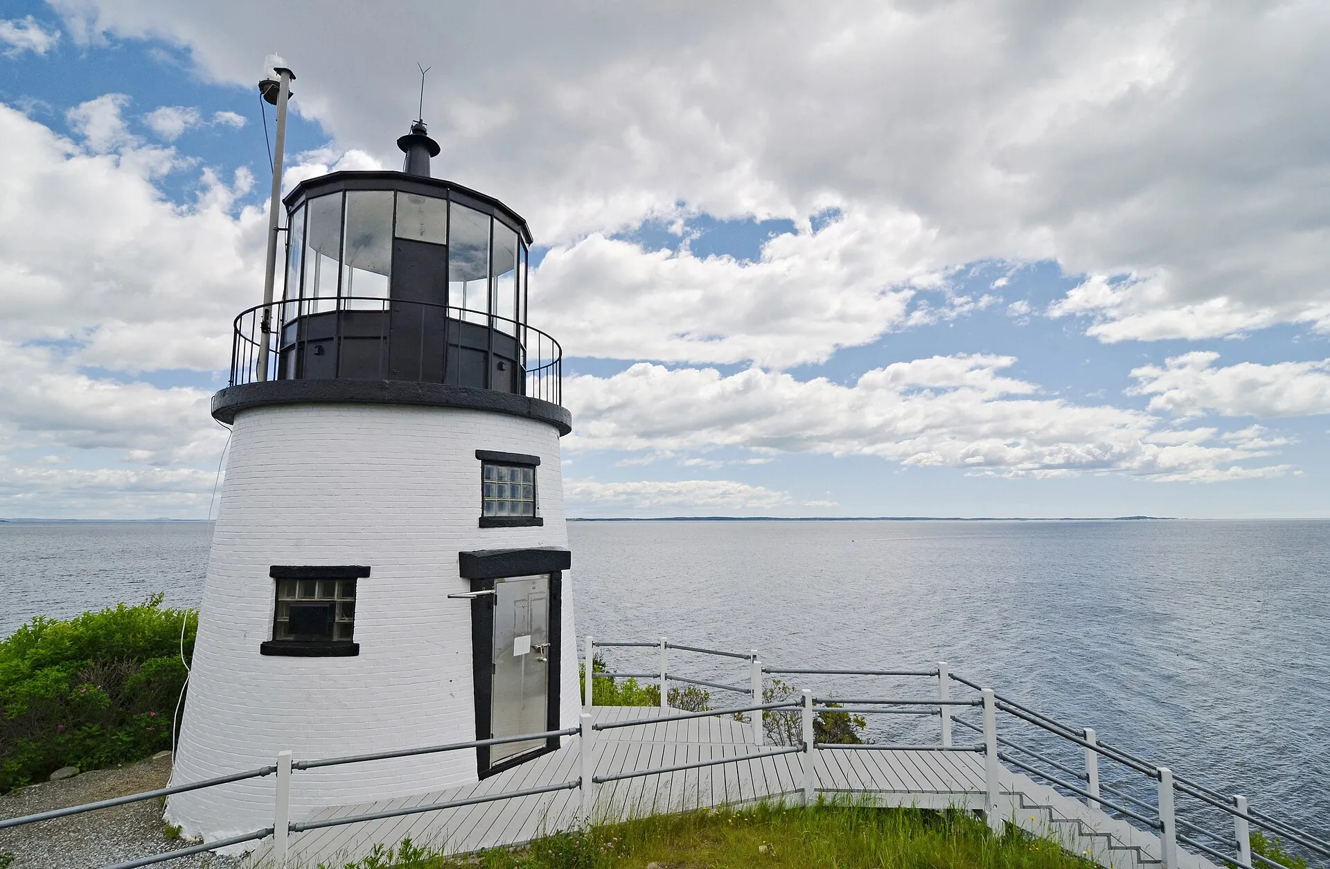 Owls Head Light, a short white tower with a black lantern room above Penobscot Bay